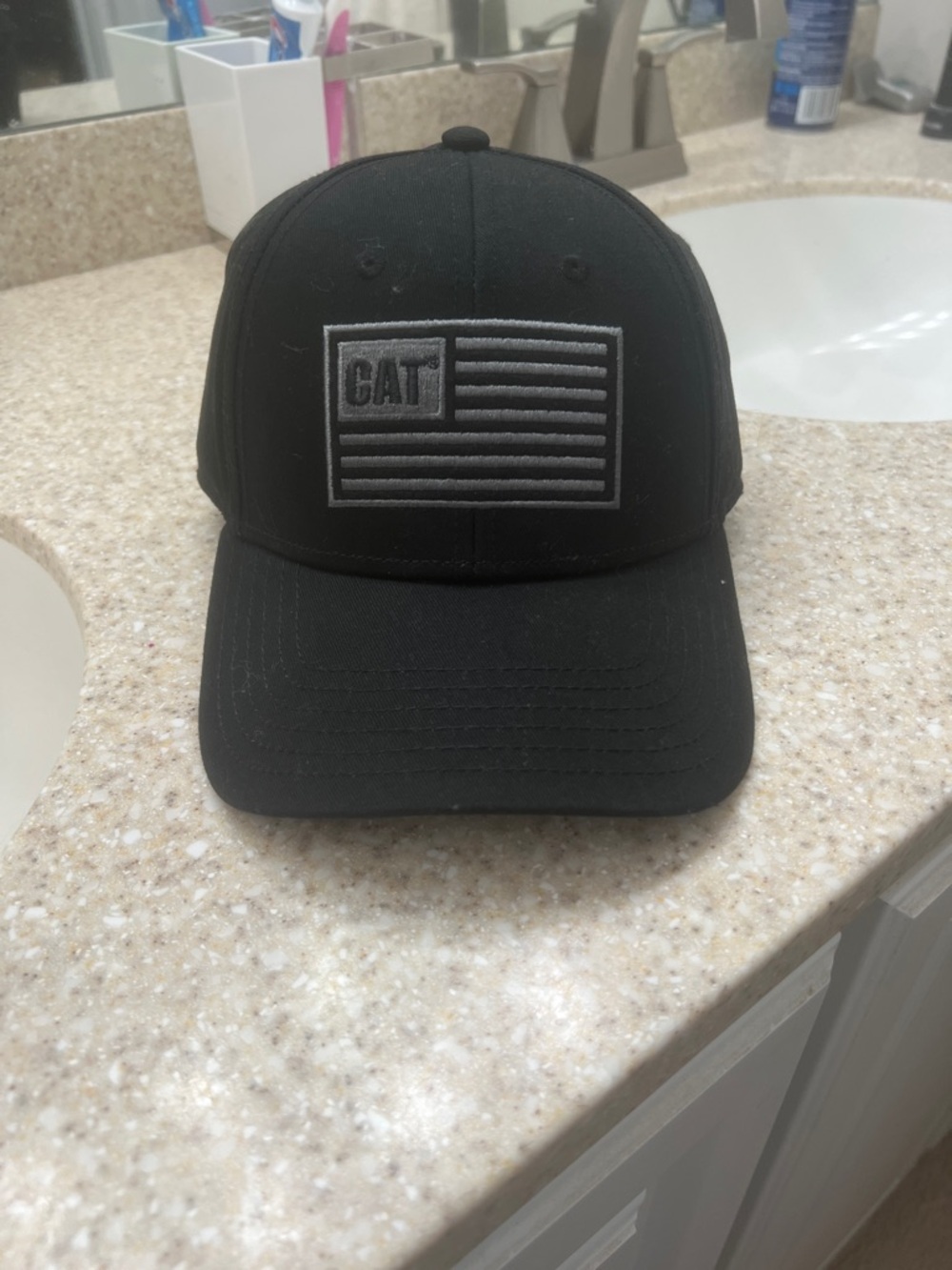 Caterpillar Black  Hat with Gray Flag Patch